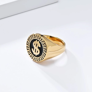 Macro shot of gold signet ring featuring black enamel with dollar sign and Greek key border
