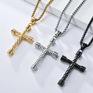 Three twisted stainless steel cross necklaces in gold, silver, and black on white background