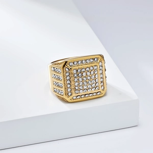 Macro shot of gold square signet ring with full rhinestone inlay in hip hop style