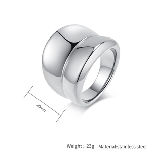 Detailed view of a 20mm wide polished silver stainless steel ring with dual curved bands
