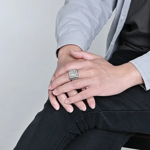Luxury silver square hip-hop ring with pavé-set diamonds on male model hands