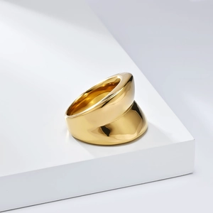 Detailed top view of a wide polished gold titanium steel ring with minimalist sleek design