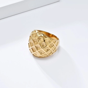 Elegant gold plated stainless steel ring with textured grid pattern on white background