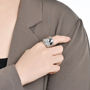 Minimalist wide polished stainless steel ring with modern irregular curved design
