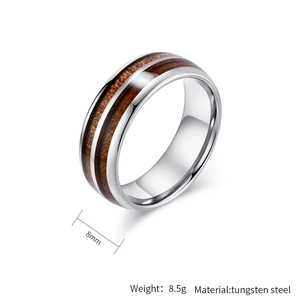 Detail of 8mm tungsten steel ring featuring dual wood grain inlay and polished edges