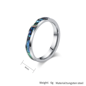 Detail view of 4mm tungsten steel ring featuring a vibrant abalone shell inlay