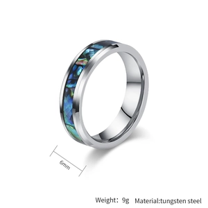 Macro shot of 6mm tungsten steel ring featuring colorful abalone shell inlay detail