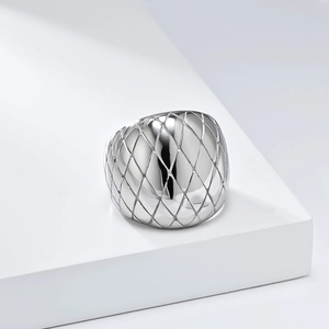 Silver-colored stainless steel wide ring featuring an elegant embossed grid pattern texture