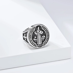 Detailed close-up of vintage St. Benedict medal ring with religious cross engraving