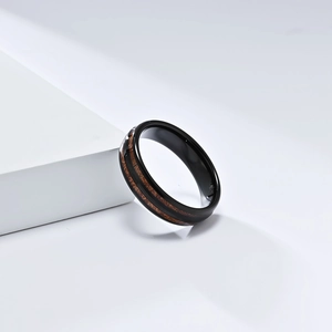 Detailed macro view of the 8mm tungsten ring with natural wood inlay and smooth inner band