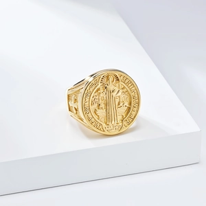 Detailed view of Saint Benedict Medal ring in gold finish with religious relief