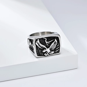 Detail of vintage eagle signet ring with American flag relief in antique silver finish