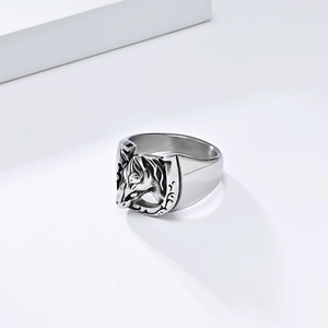 Macro shot of stainless steel horse head and horseshoe detail on a vintage style ring