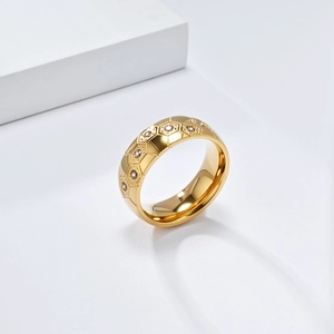 Detailed view of golden soccer ring with hexagonal honeycomb pattern and inlaid zircons