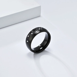 Detail of black soccer-style honeycomb textured ring with crystal pave insets