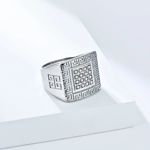 Close-up of silver square ring with Greek meander pattern and 16 cubic zirconia stones