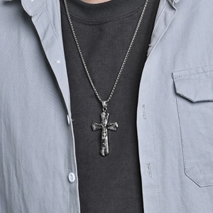 Retro stainless steel cross pendant necklace with Jesus relief on male model