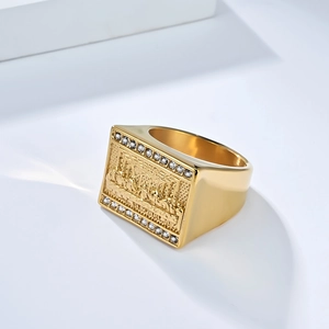 Gold plated hip hop Last Supper square ring with pavé crystals on a white background
