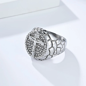 Macro detail of men's silver cross ring with full diamonds and INRI relief