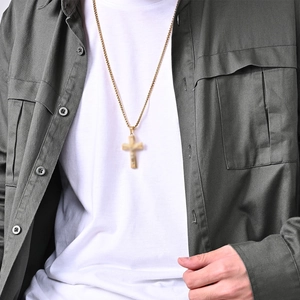 Men's vintage gold stainless steel cross necklace styled on a model with workwear shirt