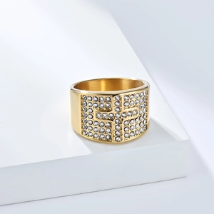 Macro view of 18K gold plated ring featuring iced out zircon cross design