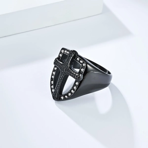Macro shot of black gothic shield ring with cross design and white crystal accents
