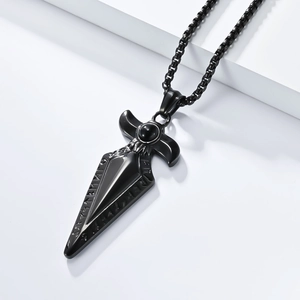 Macro shot of black stainless steel spearhead pendant with nordic rune engravings