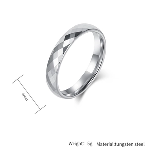 Macro detail of 4mm silver tungsten steel ring with diamond-cut geometric facets
