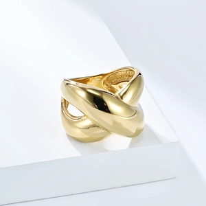 Macro detail of high-polish 18K gold-plated stainless steel twisted wide band ring