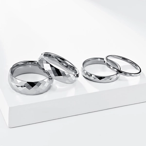 Minimalist silver tungsten rings with diamond-cut geometric facets in various widths