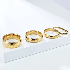Polished gold tungsten steel rings with geometric diamond cut edges in multiple widths