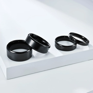 Polished black titanium steel rings in four different widths with beveled edges