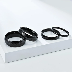 Unisex black tungsten rings with diamond-cut faceted surface in four different widths