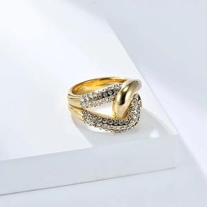 Close-up of knot ring with 18K gold plating and pave-set white cubic zirconia stones