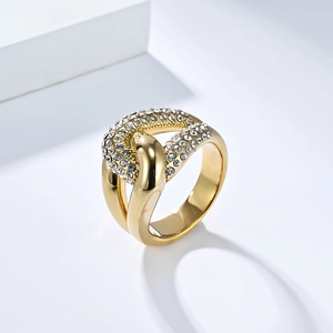 Macro shot of 18K gold plated knot ring with sparkling white zircon stones