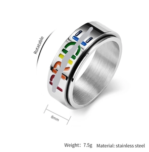 Detail of 8mm stainless steel rotatable ring with rainbow PRIDE enamel lettering