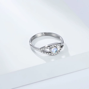 Macro shot of silver evil eye ring featuring moonstone and sparkling cubic zirconia stones