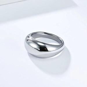 Detail view showing polished silver finish and smooth curved surface of the minimalist ring