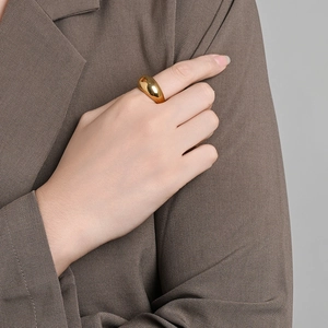 Minimalist 18K gold plated thick dome ring shown on finger for a stylish jewelry look