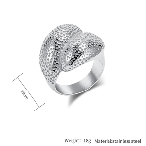 Detailed macro view of 25mm wide stainless steel ring with industrial textured surface