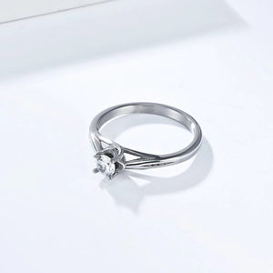 Macro view of solitaire zirconia ring featuring a classic four-prong setting on silver band
