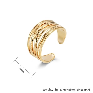 Detail view of 10mm wide gold stainless steel ring with five-layer textured lines