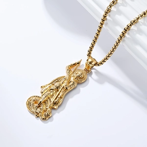 Macro shot of gold St. George and the Dragon relief pendant with polished box chain