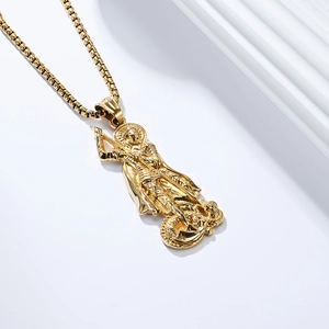 Macro shot of gold St. George dragon slayer pendant and detailed box chain links