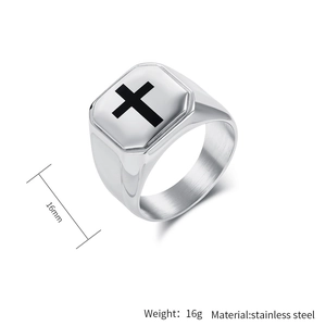Macro detail of men's stainless steel signet ring with black cross design and 16mm width