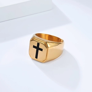 Polished gold titanium steel signet ring with black cross design on white background