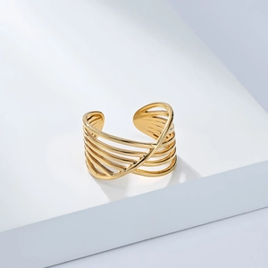 Detailed macro view of 18K gold plated multi-layer woven open ring on white display stand