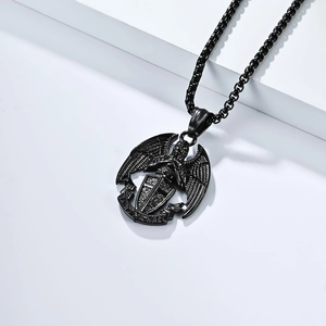 Detailed macro view of matte black Saint Michael archangel shield pendant on box chain