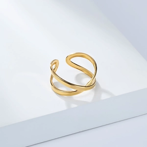 Detail of 18K gold-plated titanium steel ring with a double-layer criss-cross design