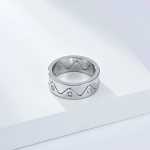 Detail of detachable crown ring with wave design and small inlaid diamonds in silver finish